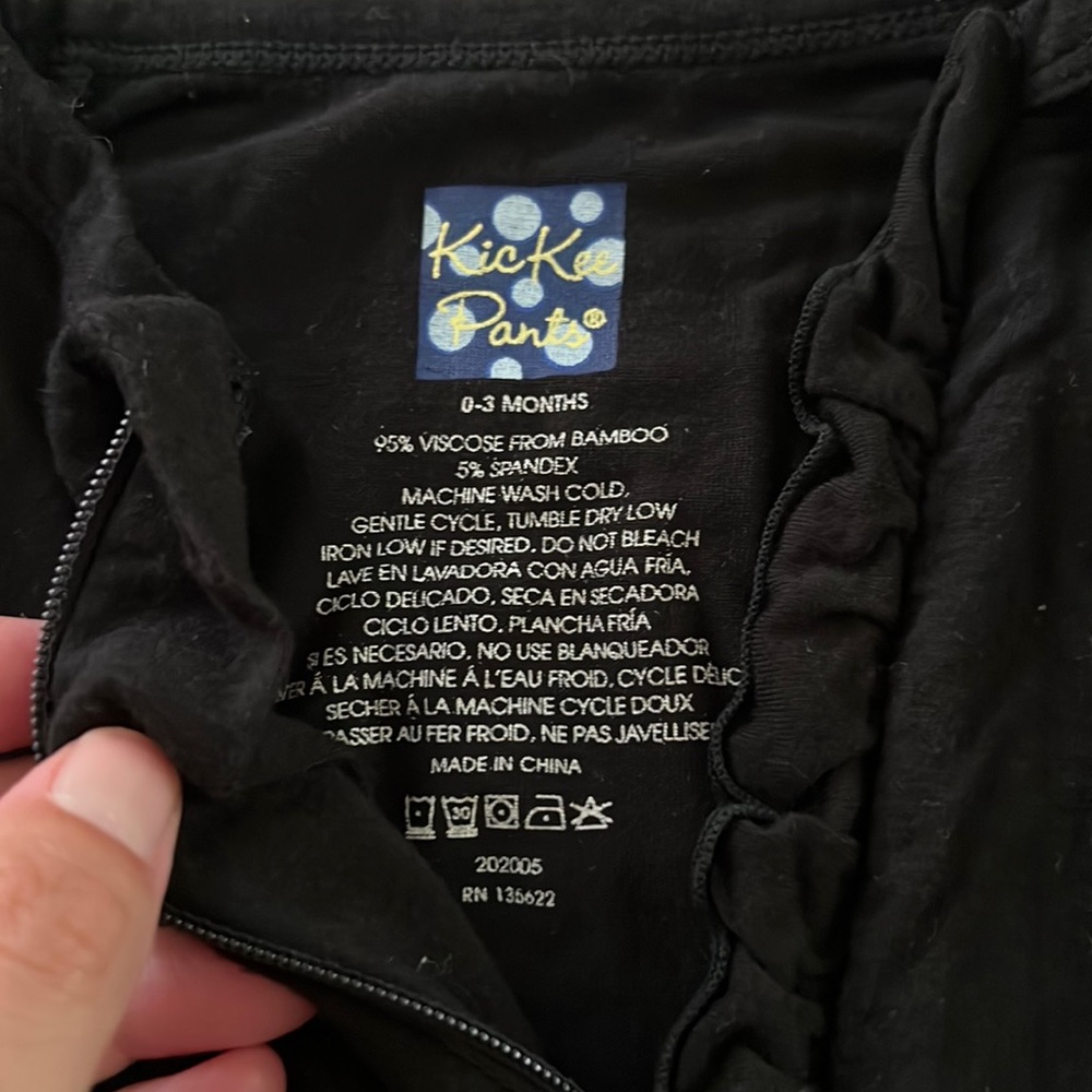 Black onesie with ruffle but sz.0-3 good used condition